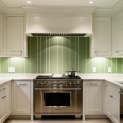 luxury kitchen with simple green wallpaper backsplash